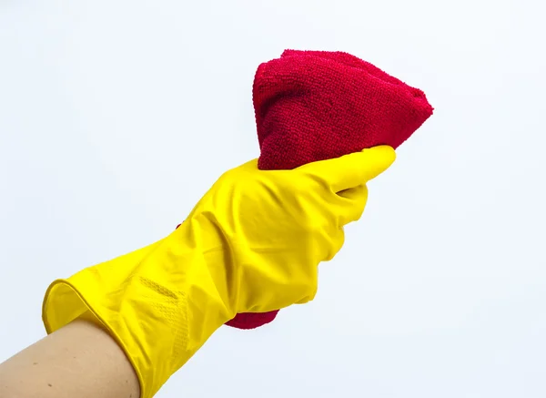 Ruku v žlutou rukavici drží speciální hadřík na čištění. — Stock fotografie