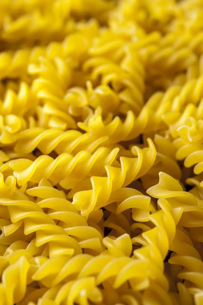 Fusilli pasta background, close up. Итальянская кухня . — стоковое фото
