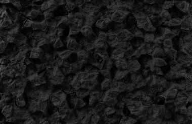 Büyük düzensiz kaya çıkıntıları ve engebeli arka planlar için derin gölgeleri olan dramatik koyu griden siyah taşa doğru bir doku..