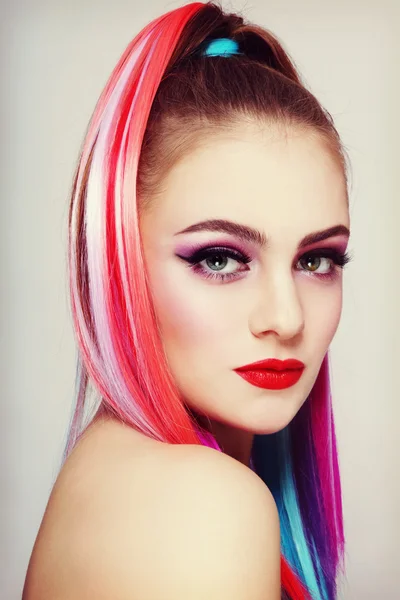 Beautiful girl with colorful ponytail — Stock Photo, Image