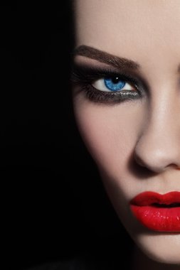 face with red lips and smoky eyes clipart