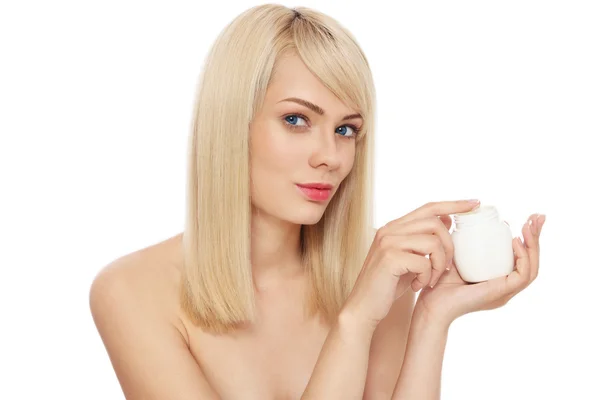 Woman with pot of face cream — Stock Photo, Image