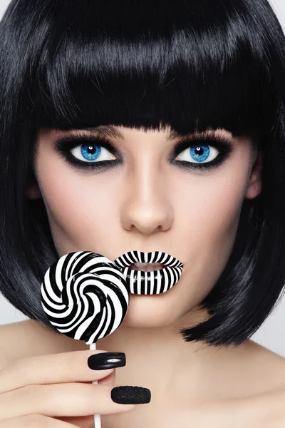 Brunette with striped lips and fancy lollipop — Stock Photo, Image