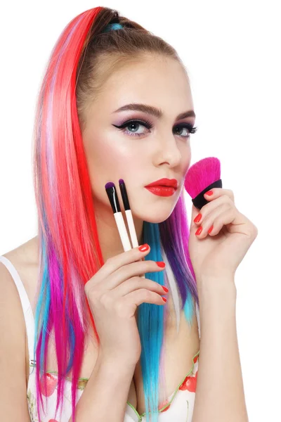 Woman with colorful ponytail and make-up brushes — Stock Photo, Image