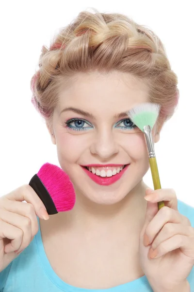 Blond woman with make-up brushes — Stock Photo, Image