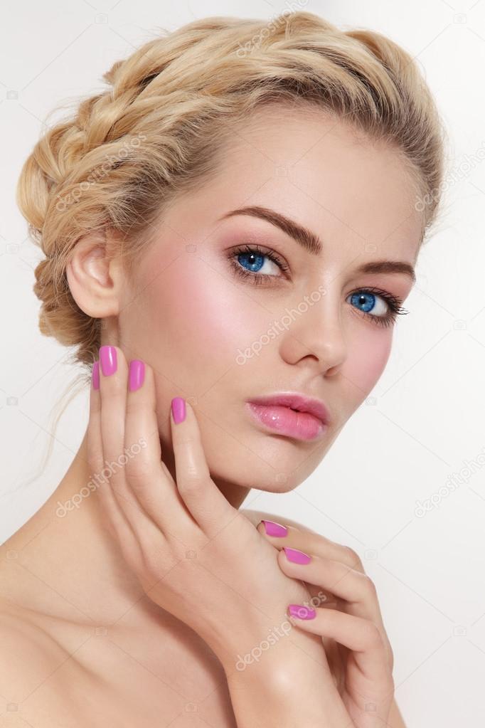 blond girl with pink make-up and manicure