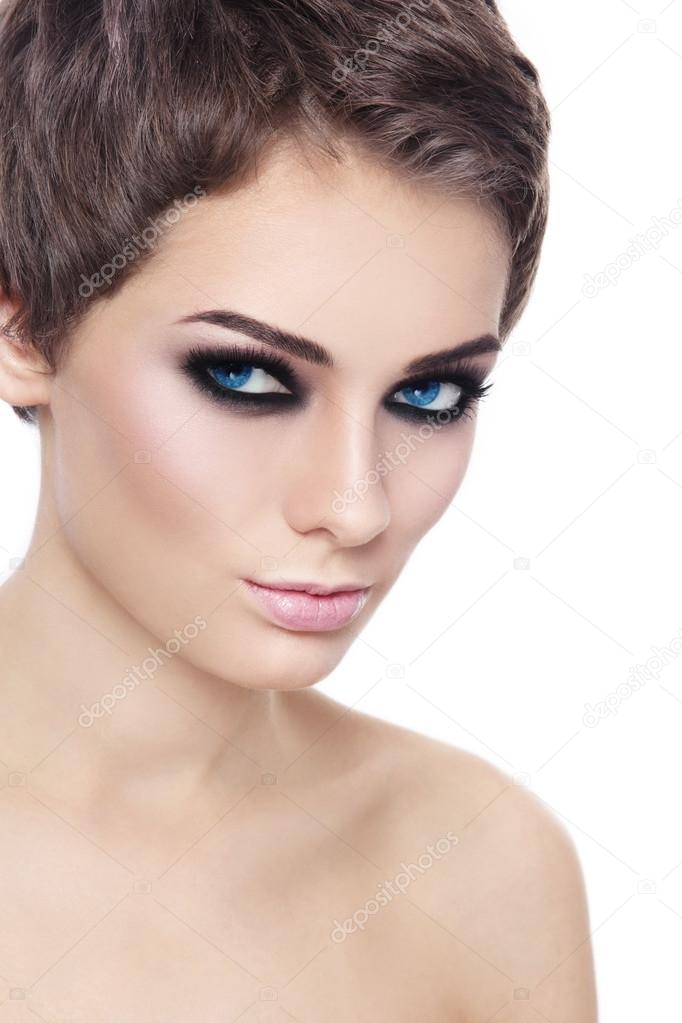 woman with stylish short haircut and smoky eyes