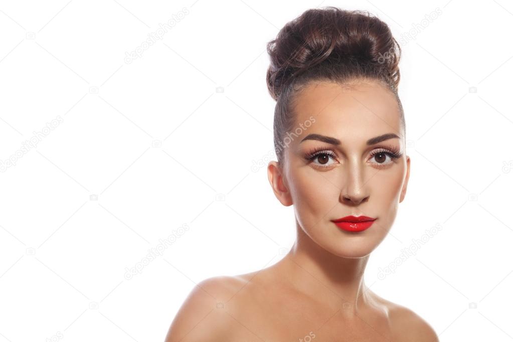 woman with hair bun and red lipstick