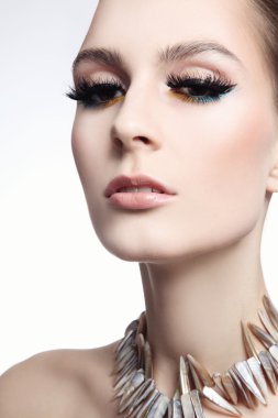 slim woman with false eyelashes and fancy