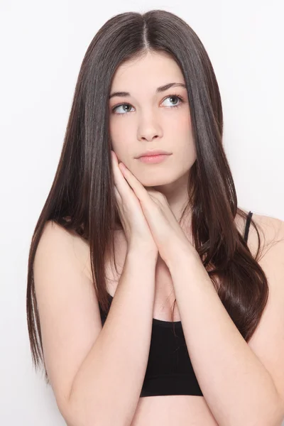 Girl with long hair and unhappy expression — Stock Photo, Image