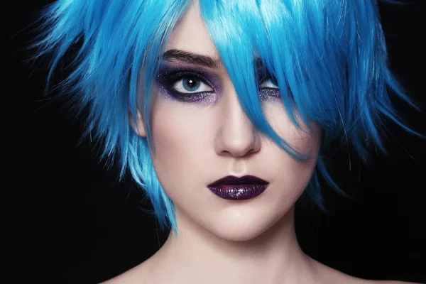 Beautiful woman in blue cosplay wig — Stockfoto