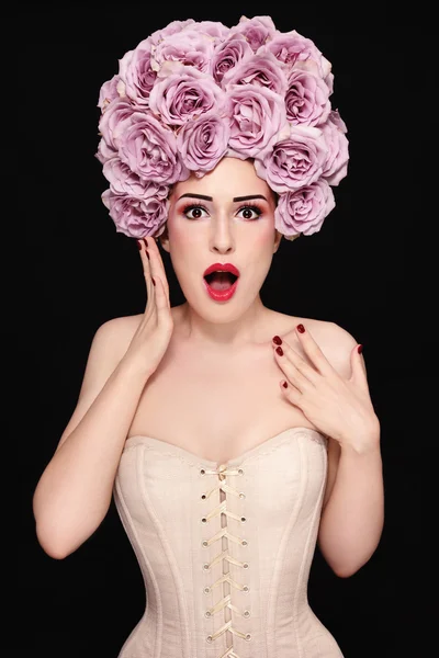 Woman in corset with fancy wig of roses — 스톡 사진