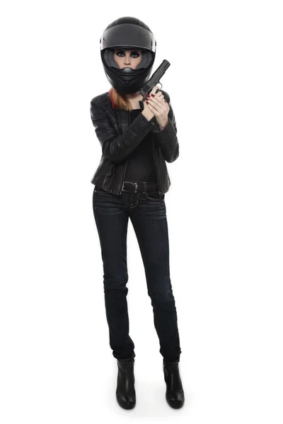 Woman in biker helmet with pistol — Stok fotoğraf