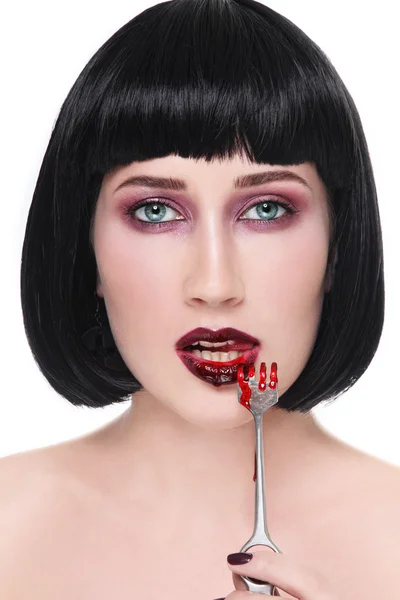 Brunette woman with bloody fork — Zdjęcie stockowe