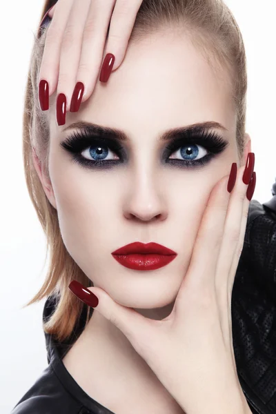 Woman with smoky eyes and long nails 图库图片