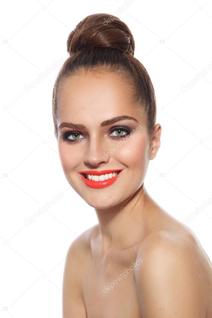 woman with stylish make-up and hair bun