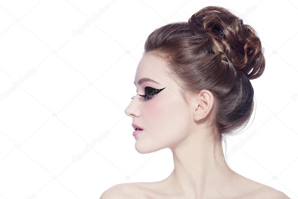 Woman with hair bun and cat eyes Stock Photo by ©pepperbox 75733629