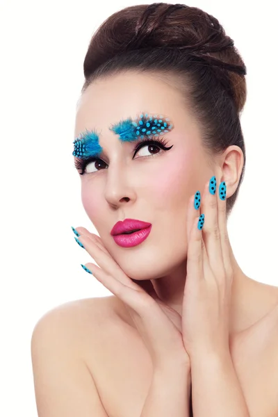 Beautiful woman with fancy feathers eyebrows — Stock Photo, Image