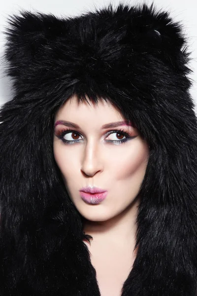 Beautiful girl in funky fur hat — Stock Photo, Image