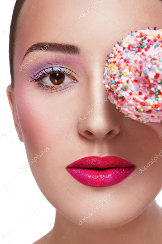 beautiful girl with colorful cupcake