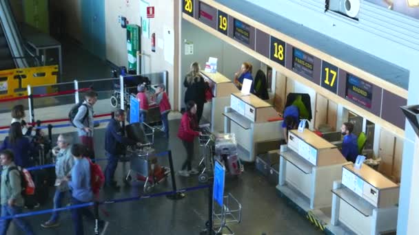 Airline Passengers Checking in at an Airline Counter — Stock Video