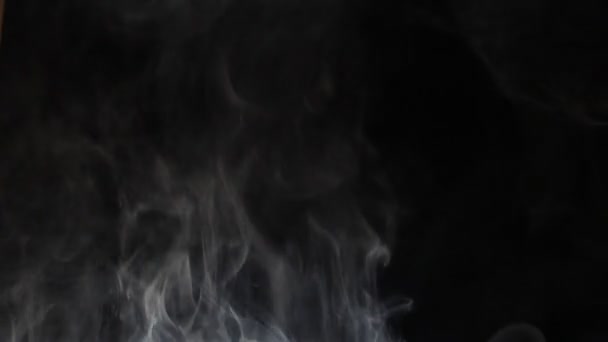 Humo subiendo sobre negro — Vídeo de stock