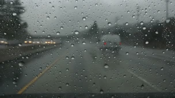 Raindrops moving across windshield — Stock Video