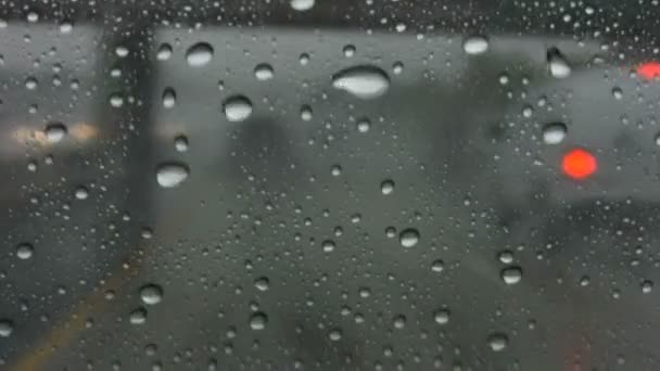 Raindrops moving across the windshield — Stock Video