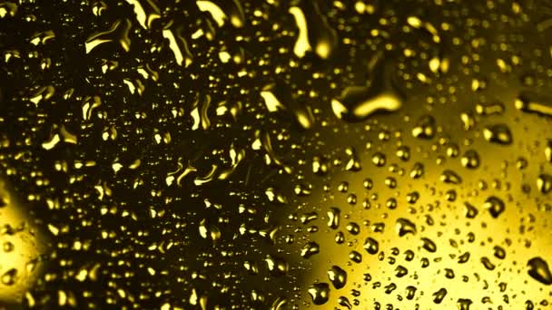 Gouden waterdruppels — Stockvideo