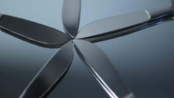 Five Scalpels fanned out rotating on mirror — Stock video