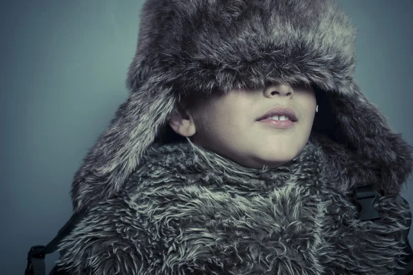 Child wearing fur hat — Stock Photo, Image