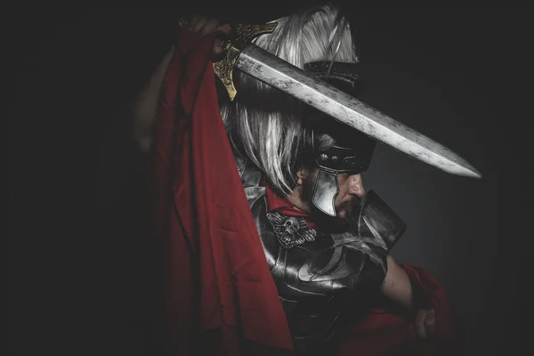 Roman legionary holding sword — Stock Photo, Image