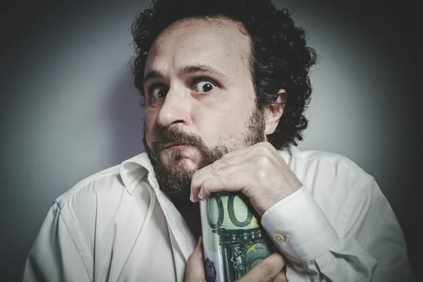 Muž v bílé košili drží peníze box — Stock fotografie
