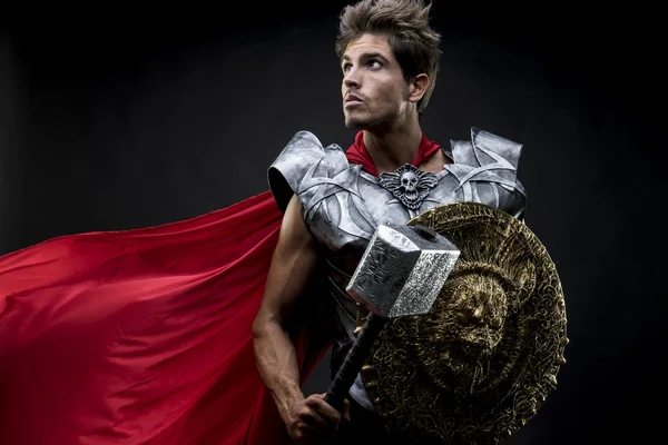 Centurion or Roman warrior with iron armor, military helmet with — Stock Photo, Image
