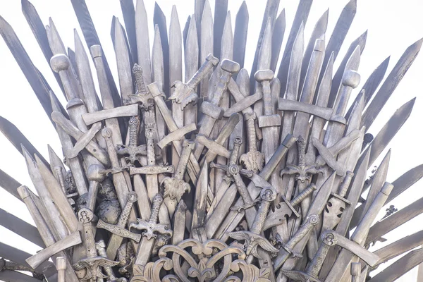 Fair, royal throne made of iron swords, seat of the king, symbol — Stock Photo, Image