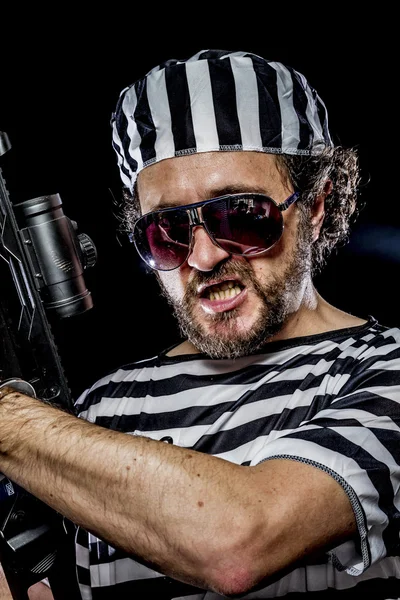 Man holding a machine gun — Stock Photo, Image