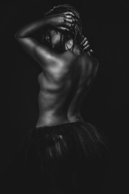 Half-naked woman in black tutu