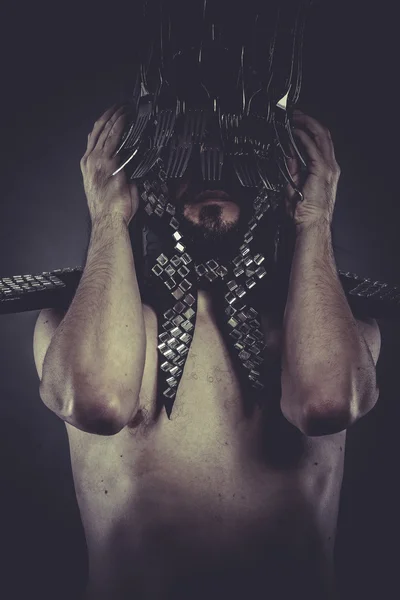 Man with helmet made of forks — Stock Photo, Image