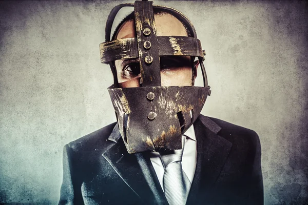 Hombre de negocios peligroso con máscara de hierro —  Fotos de Stock