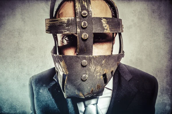 Dangerous business man with iron mask — Stock Photo, Image