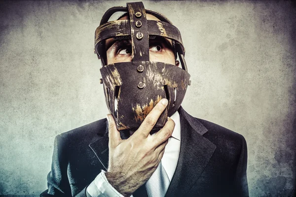 Dangerous business man with iron mask — Stock Photo, Image