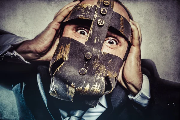 Dangerous business man with iron mask — Stock Photo, Image