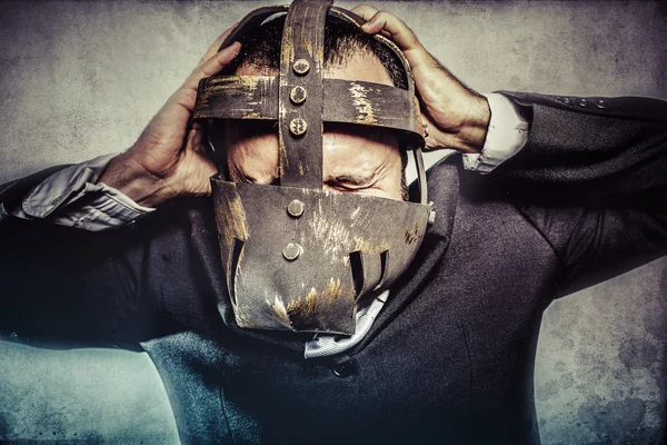 Dangerous business man with iron mask — Stock Photo, Image