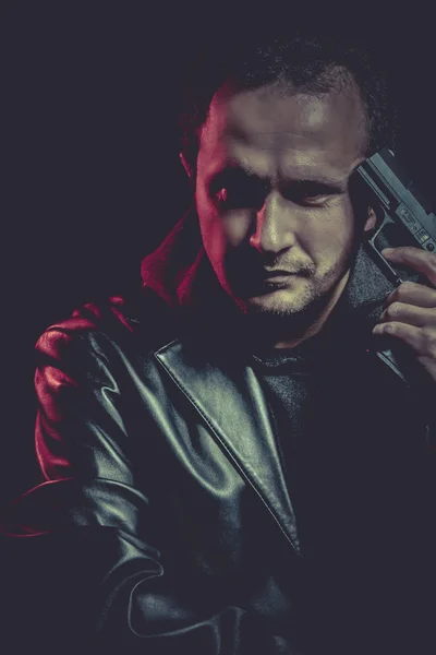 Man with a gun — Stock Photo, Image