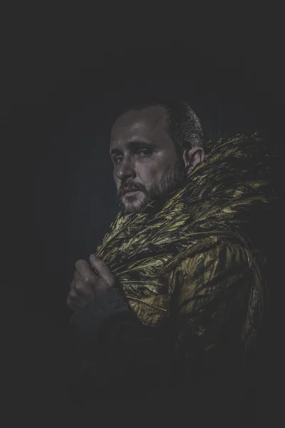 Man with beard and suit made with golden wings — Stock Photo, Image