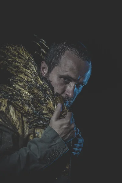 Man with beard and suit made with golden wings — Stock Photo, Image