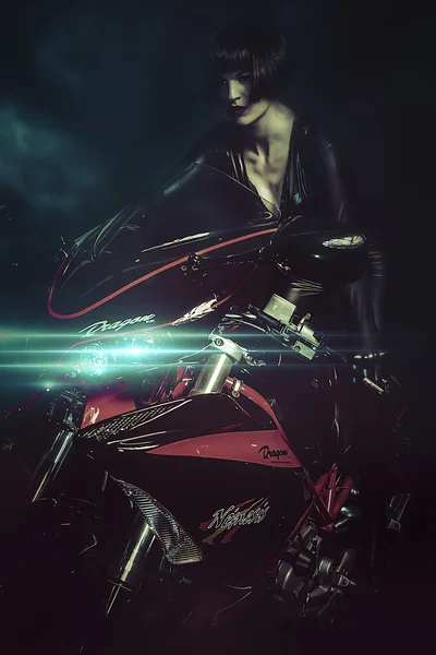 Sensual brunette woman on motorcycle