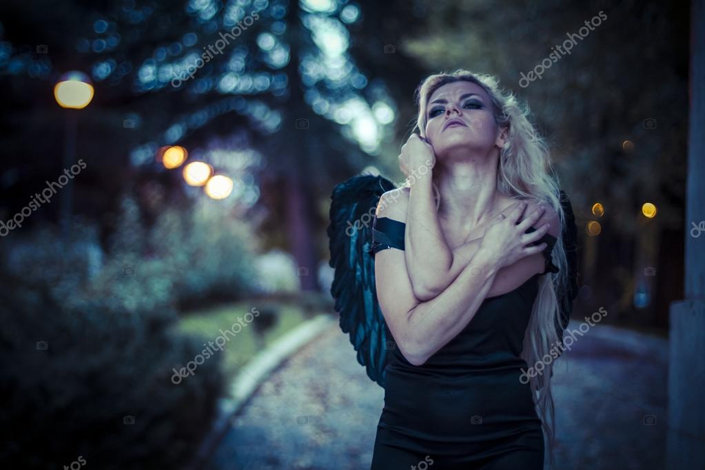 Blonde angel with black wings — Stock Photo © outsiderzone #61812225