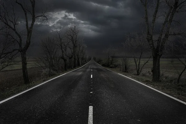 Abandoned road at sunset — Stock Photo, Image