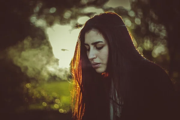 Young, beautiful woman at sunset — Stock Photo, Image